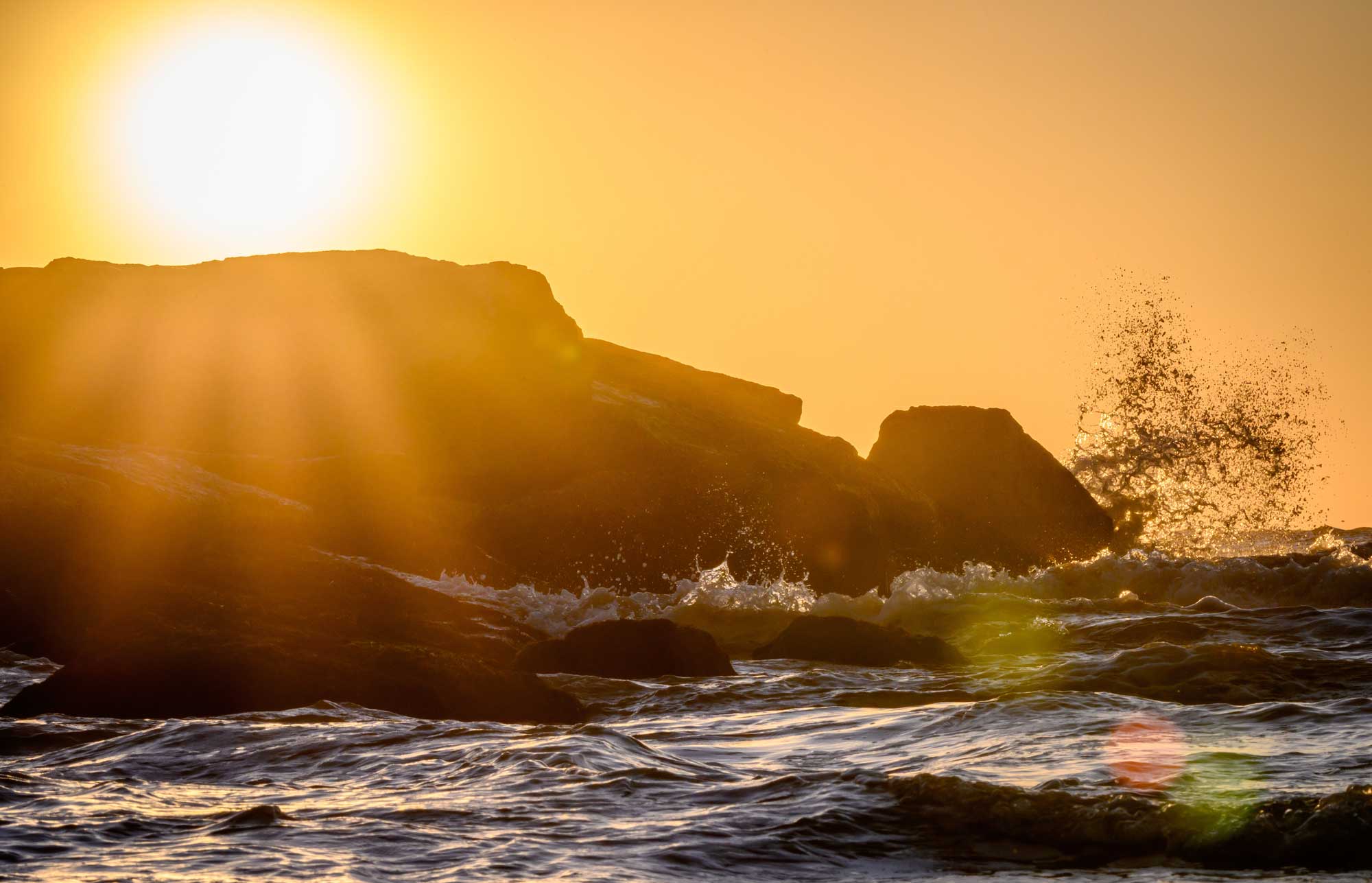 wave crashing into shores