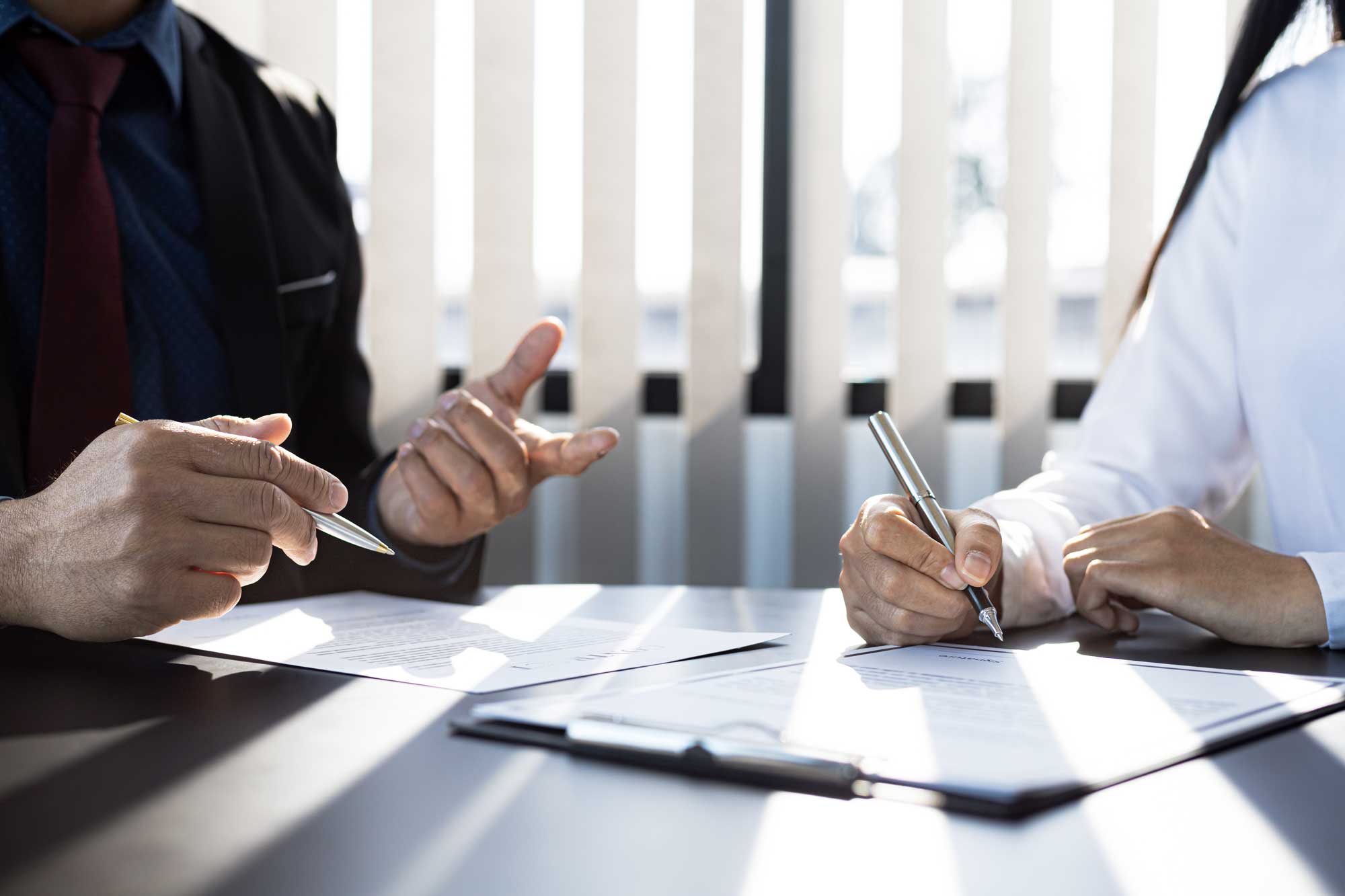 desk financial professionals studying charts discussion